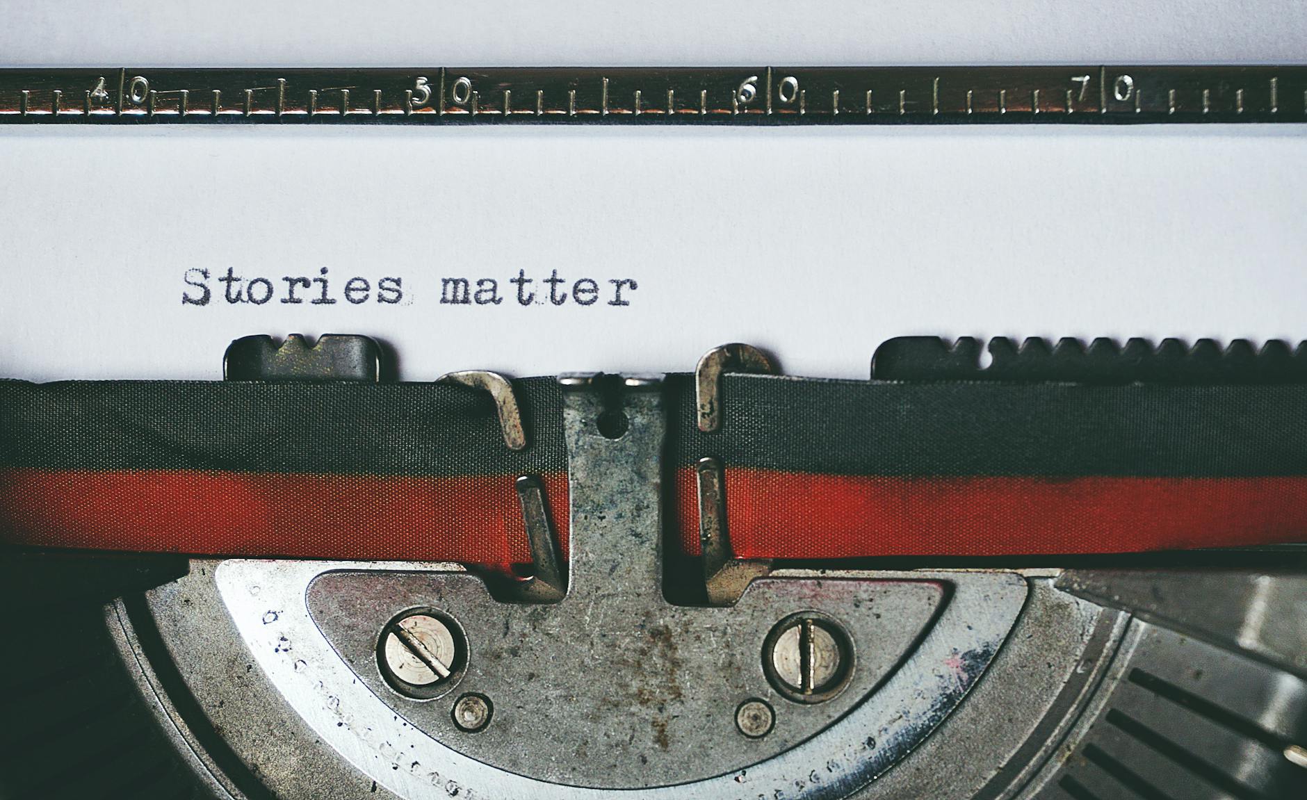 Typewriter with text on paper: Stories matter