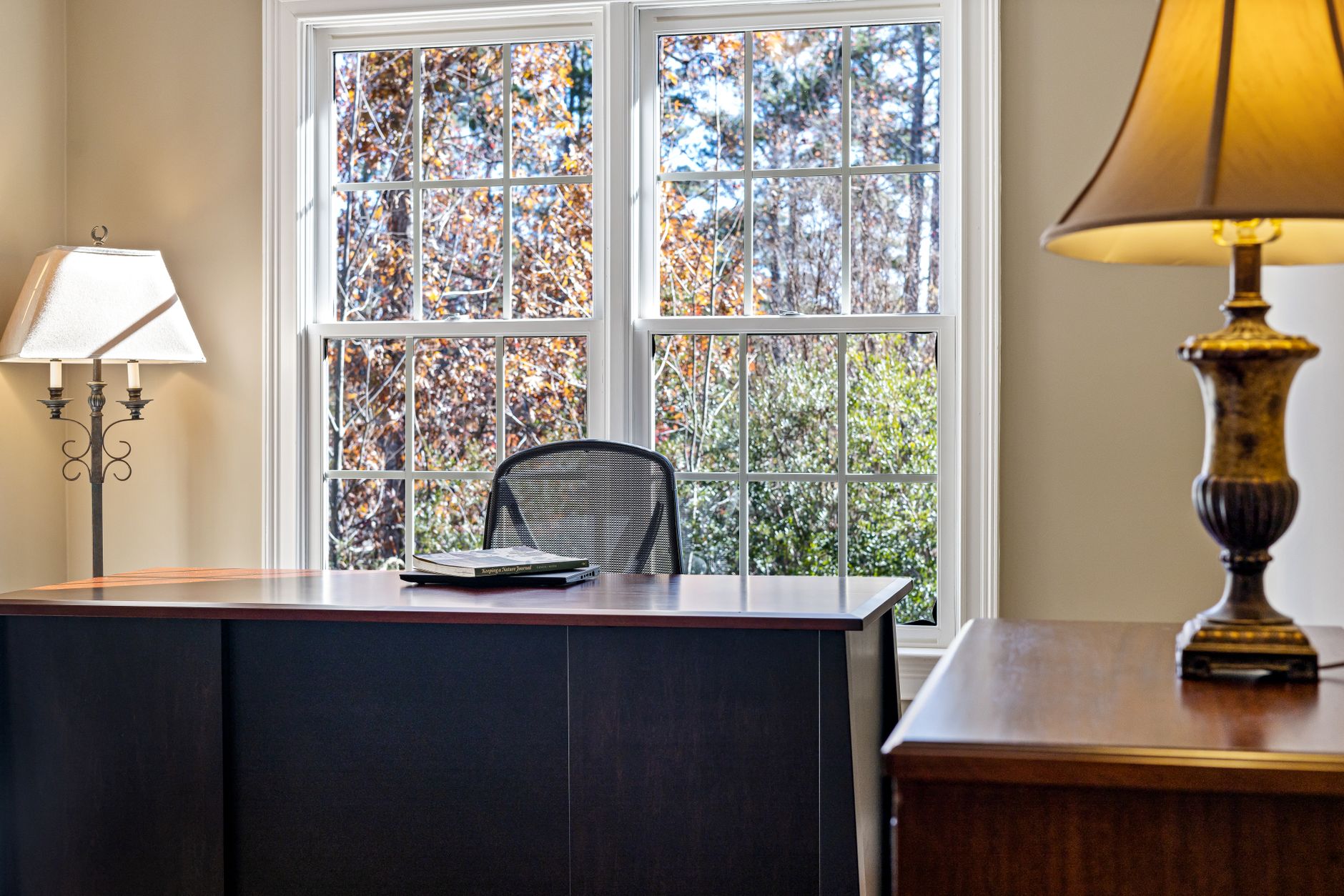 books lying on desk by window